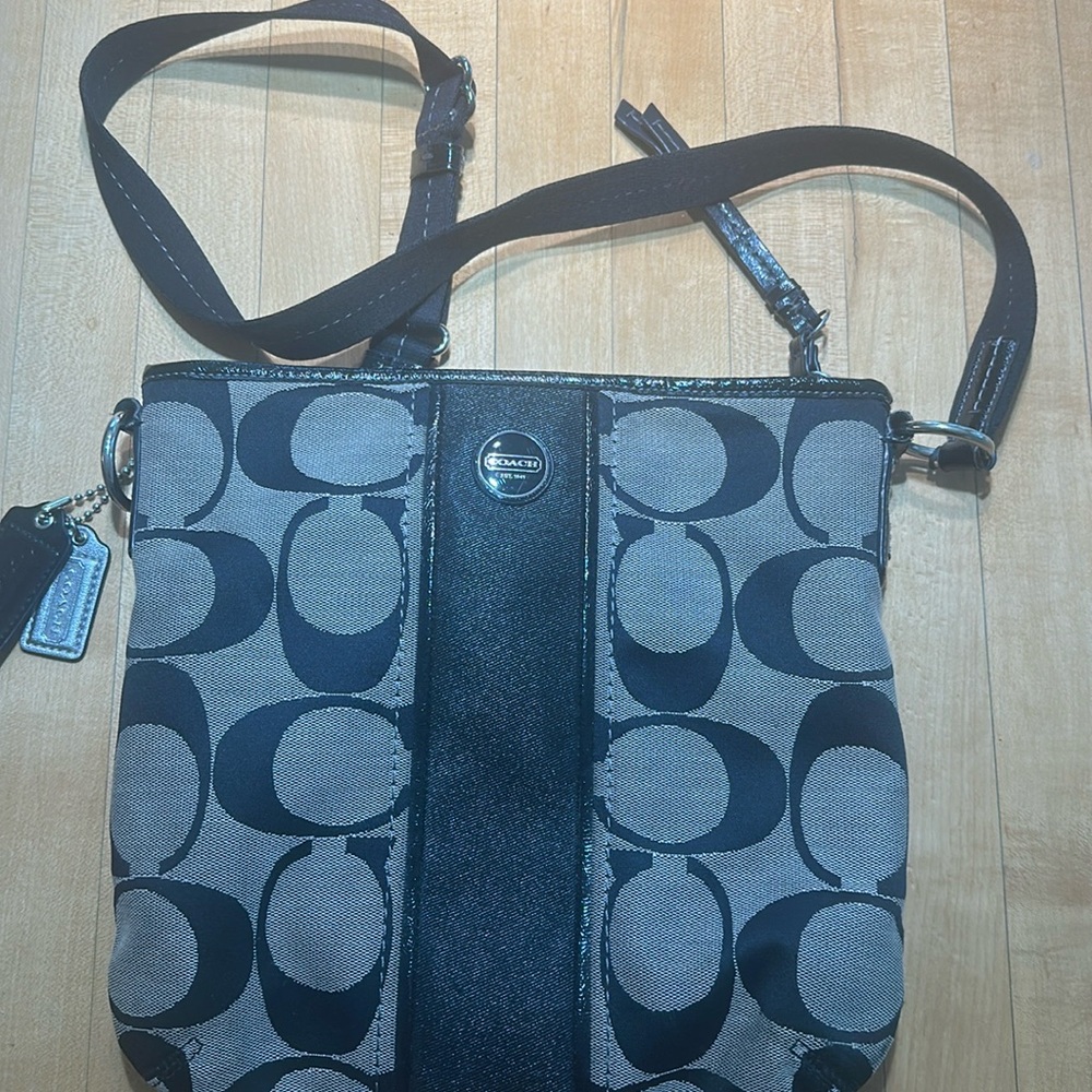 Black signature Coach logo crossbody bag with black patent leather trim